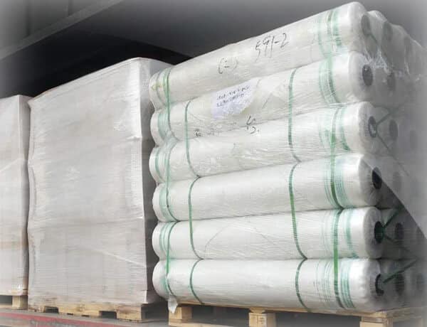 Silopak bale net wrap rolls stacked and stretch wrapped on a pallet ready for export