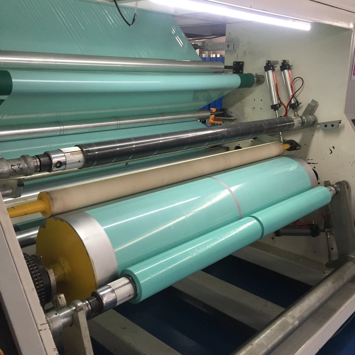 Teal silage film being produced and wound on the casting machine at the Silopak factory in China